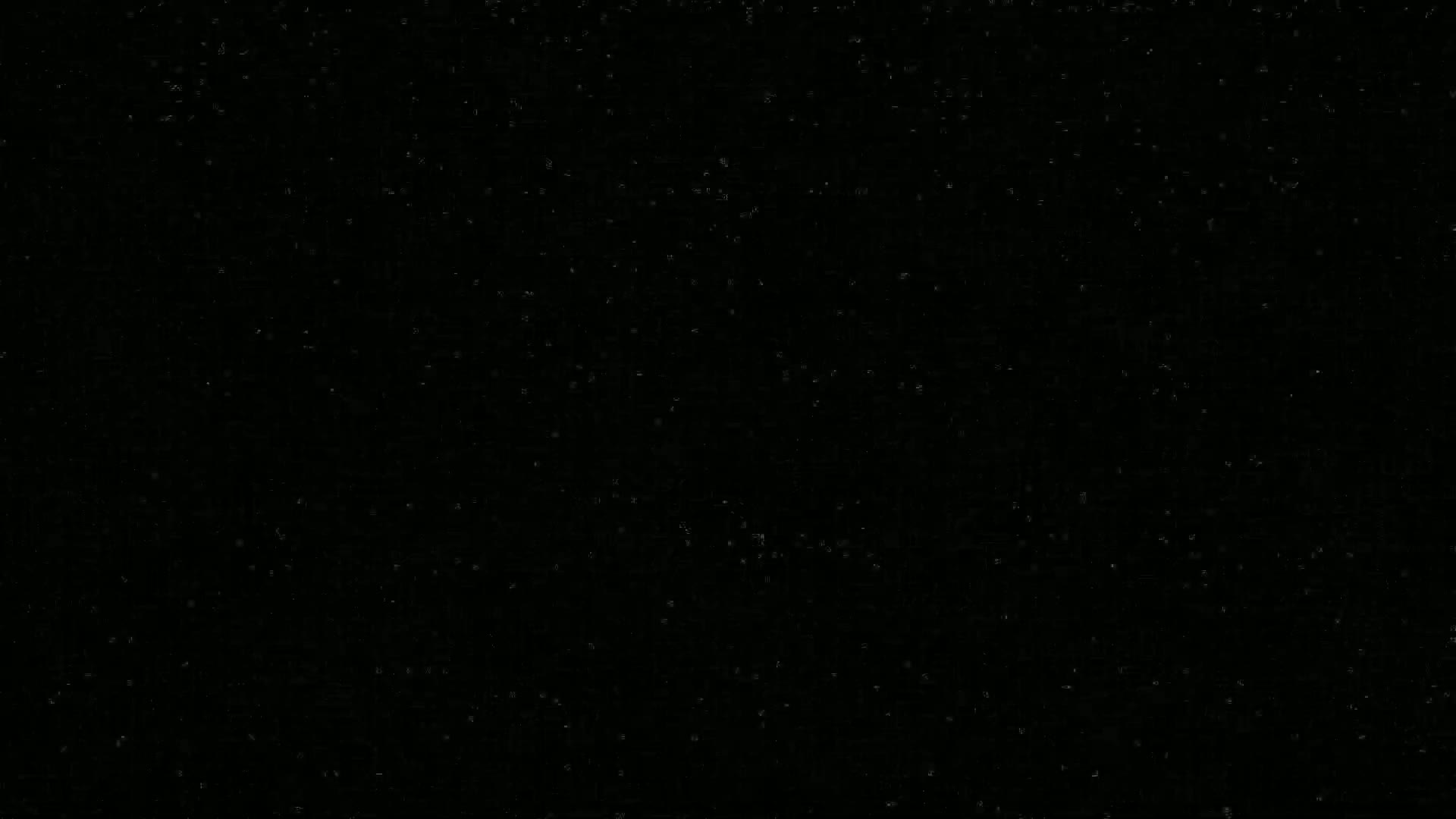 The image shows a dark surface speckled with tiny, faint lights.