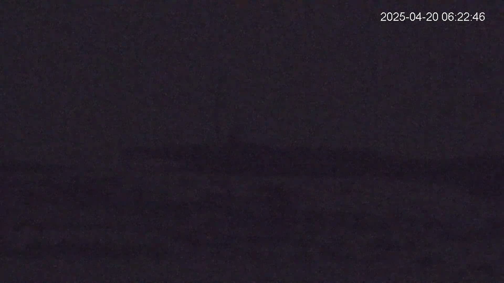 A dark, blurry image shows an indistinct, possibly nighttime scene.