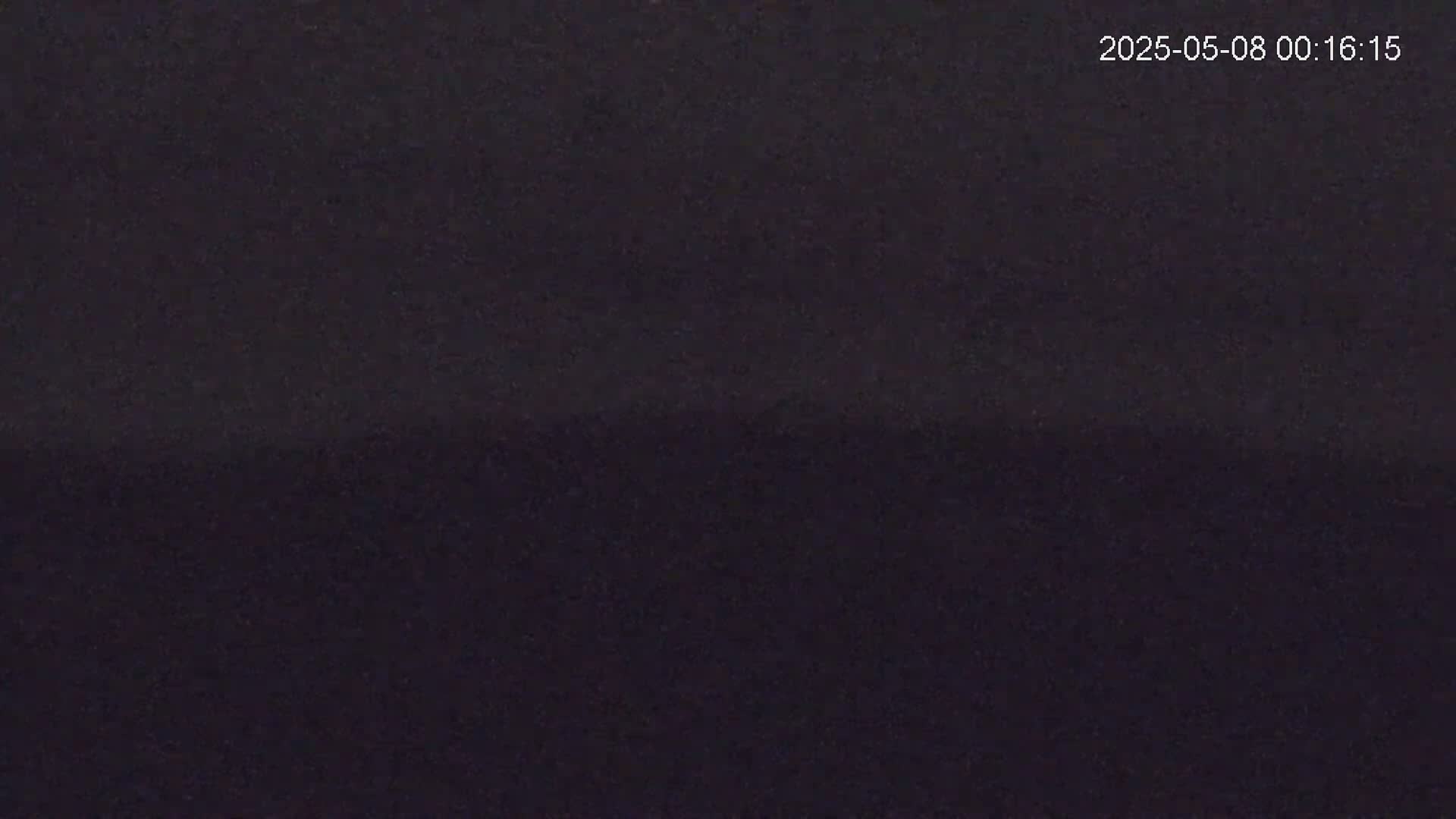 The image shows a dark, uniformly colored surface.