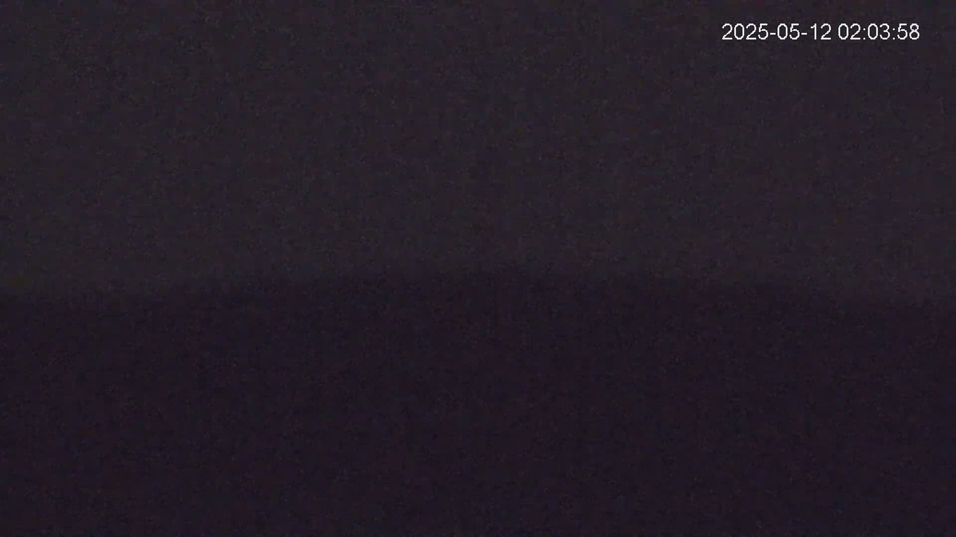 The image shows a dark, nighttime scene.