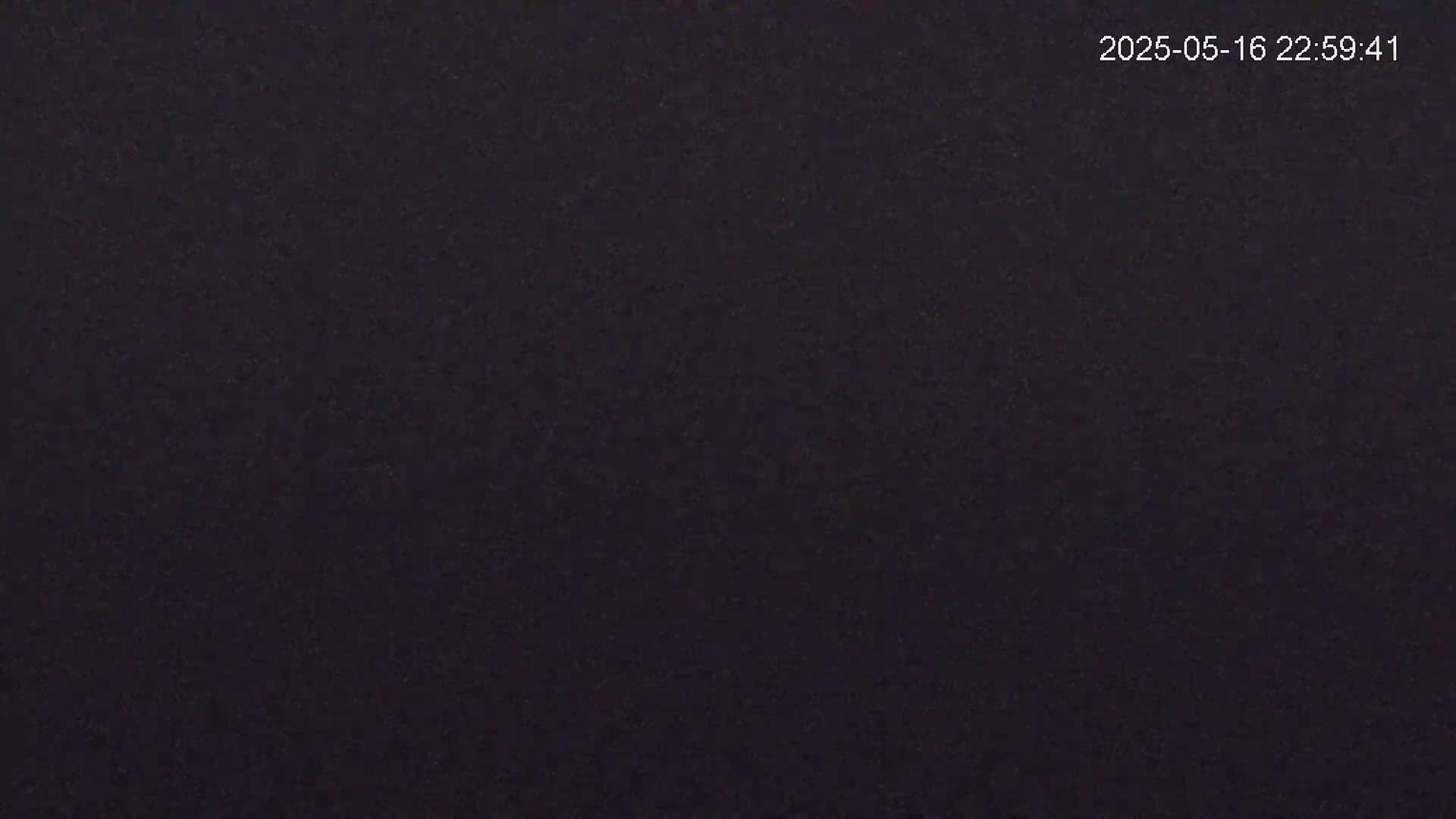 The image shows a completely dark, uniformly textured surface.