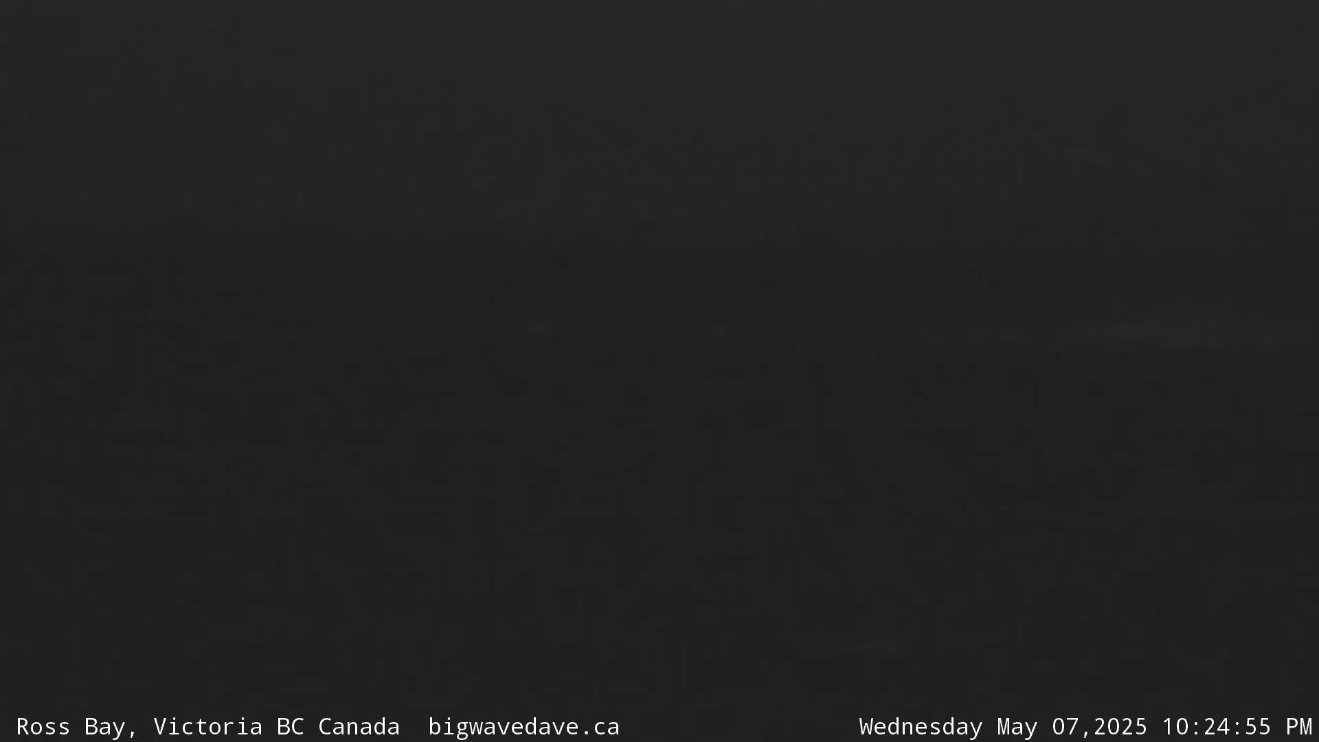 A dark, possibly nighttime image shows a uniformly dark gray-black scene.