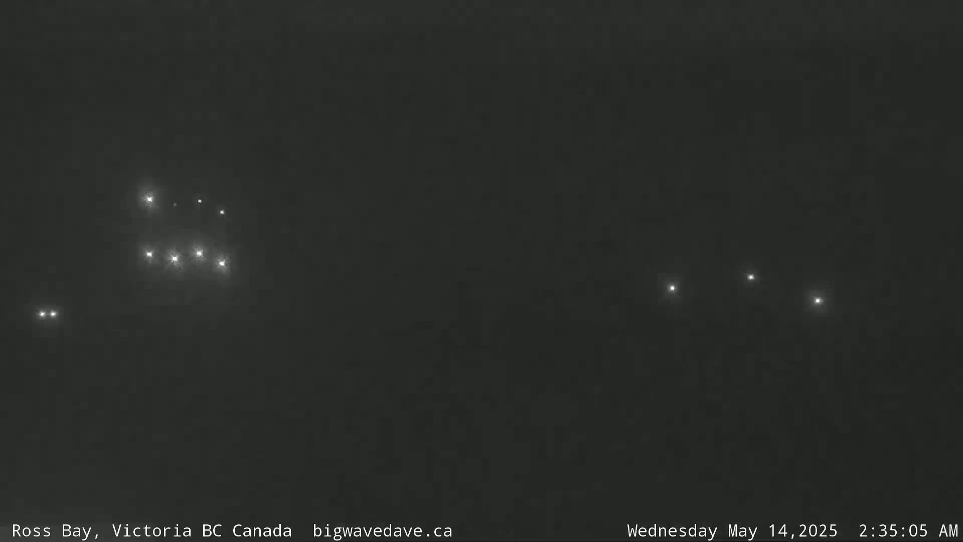 Several bright lights are visible in the dark night sky.