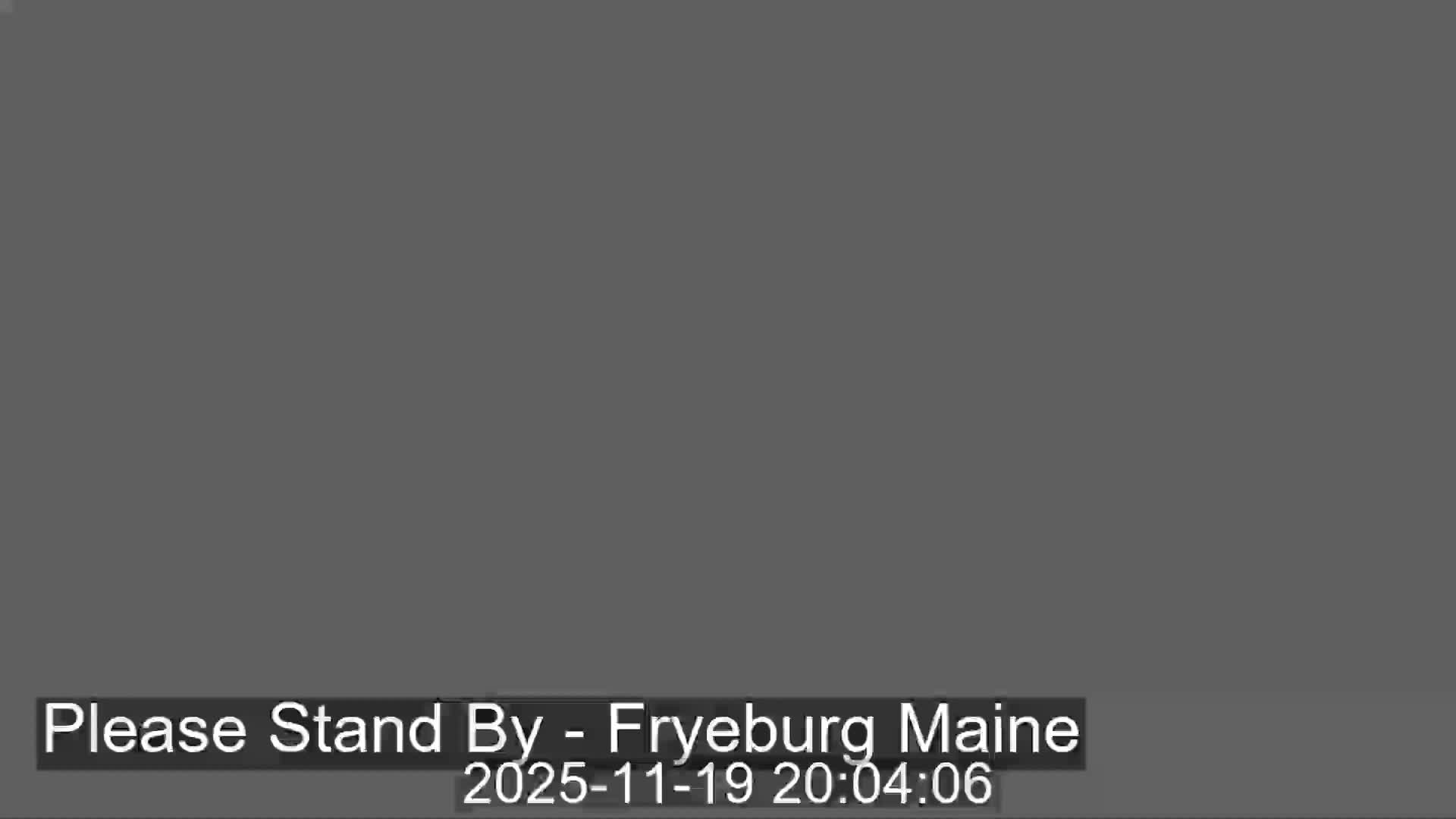 The image displays an outdoor scene characterized by extremely low visibility, suggesting dense fog or heavily overcast conditions.