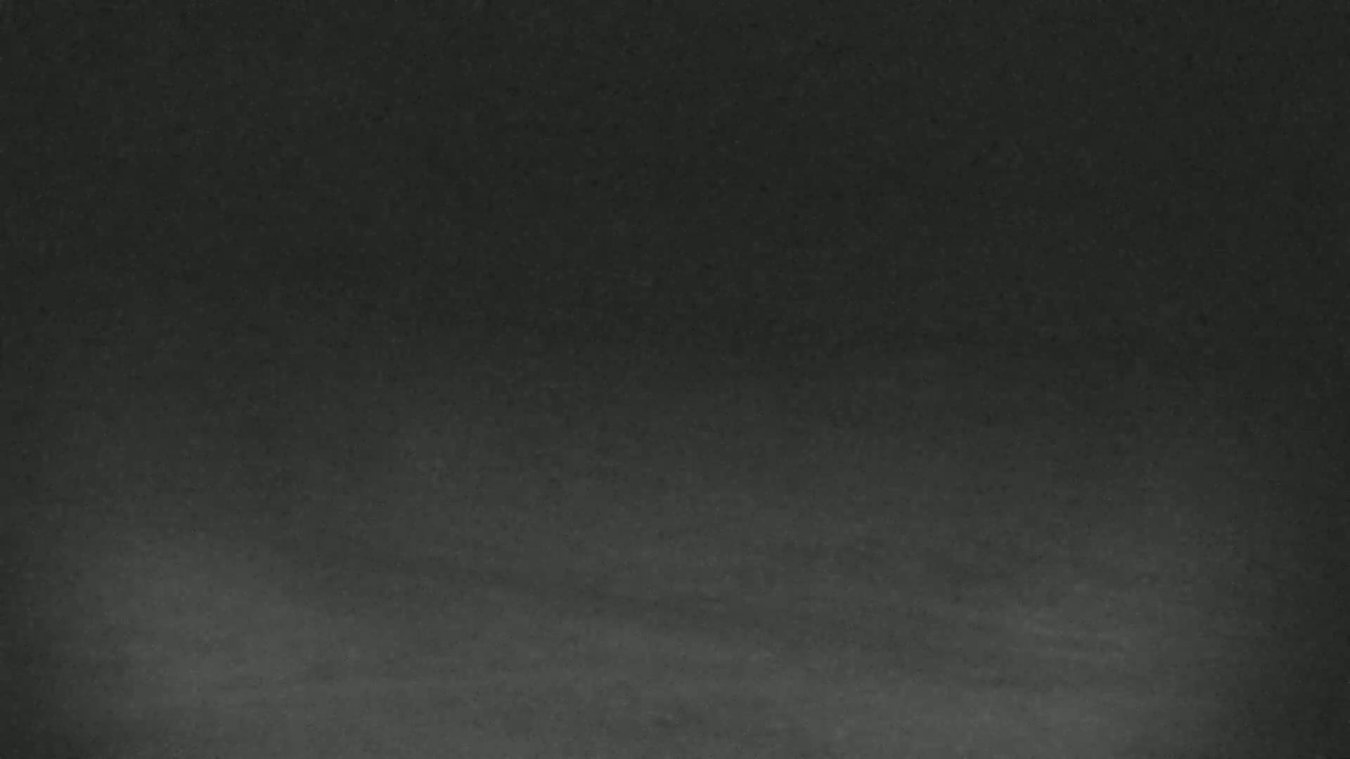 A dark gray textured surface is shown, possibly a chalkboard or a similar material.