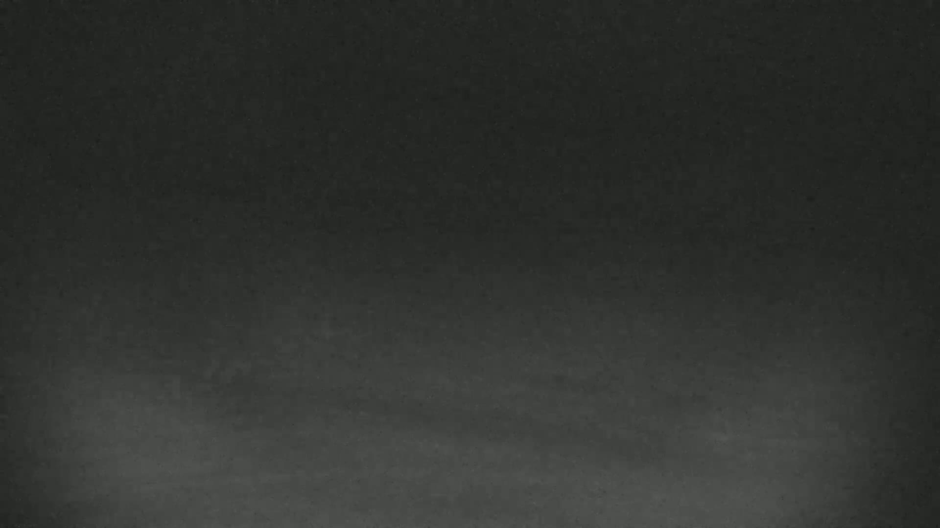 The image shows a dark gray textured surface.