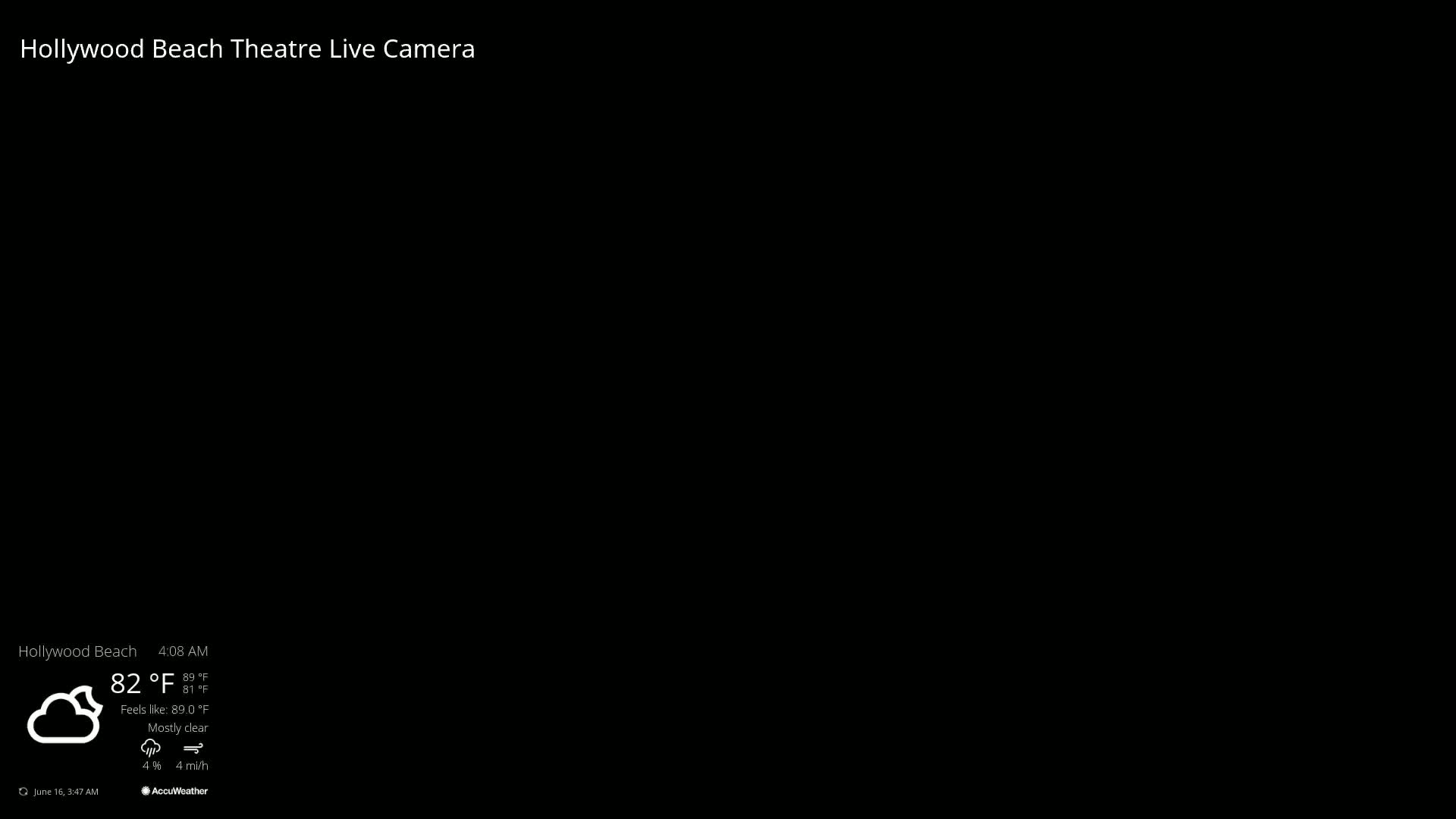A mostly clear, 82°F morning is shown on a black screen displaying a live camera feed of the Hollywood Beach Theatre.