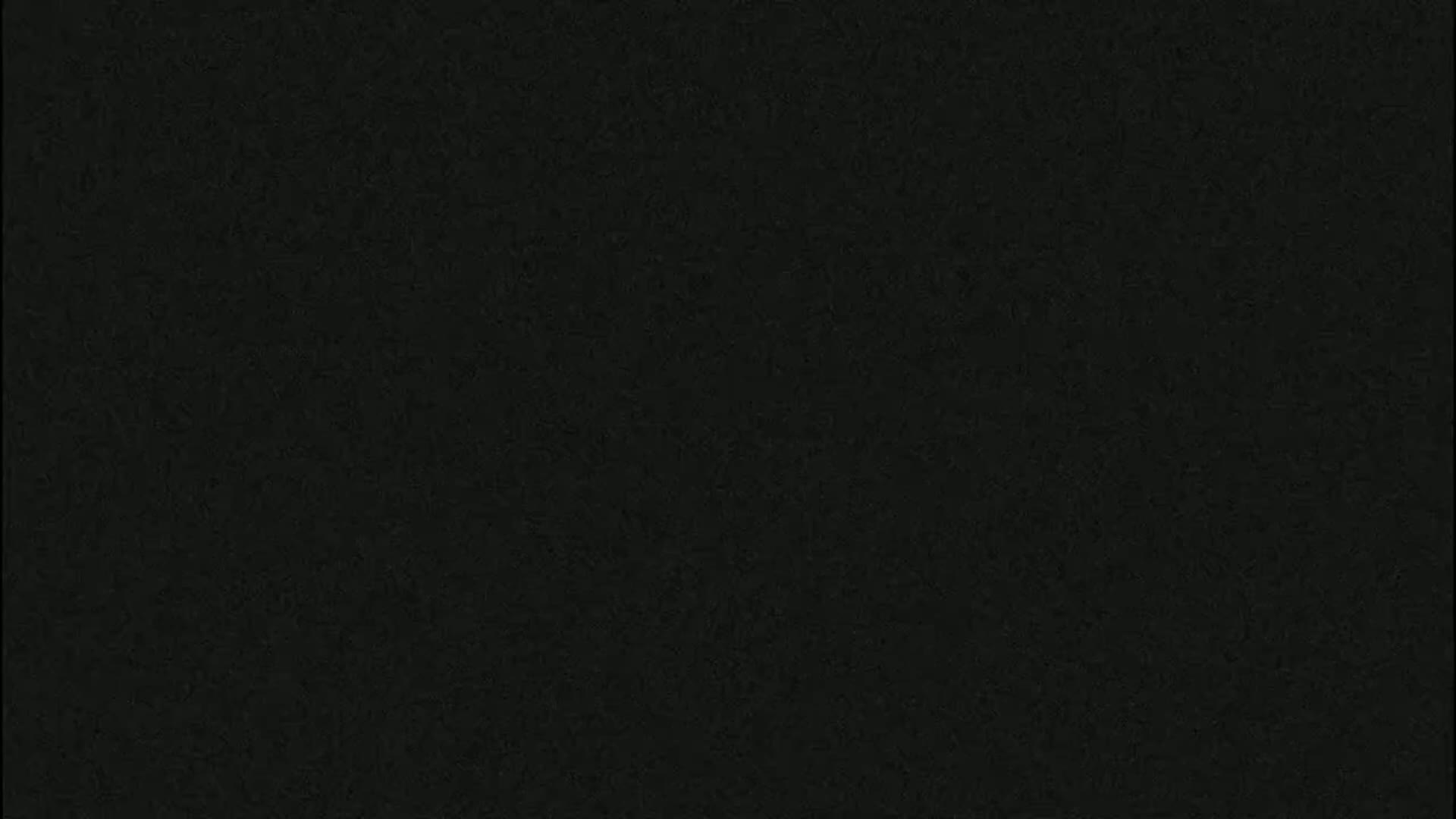 The image is a solid dark-gray/black textured background.