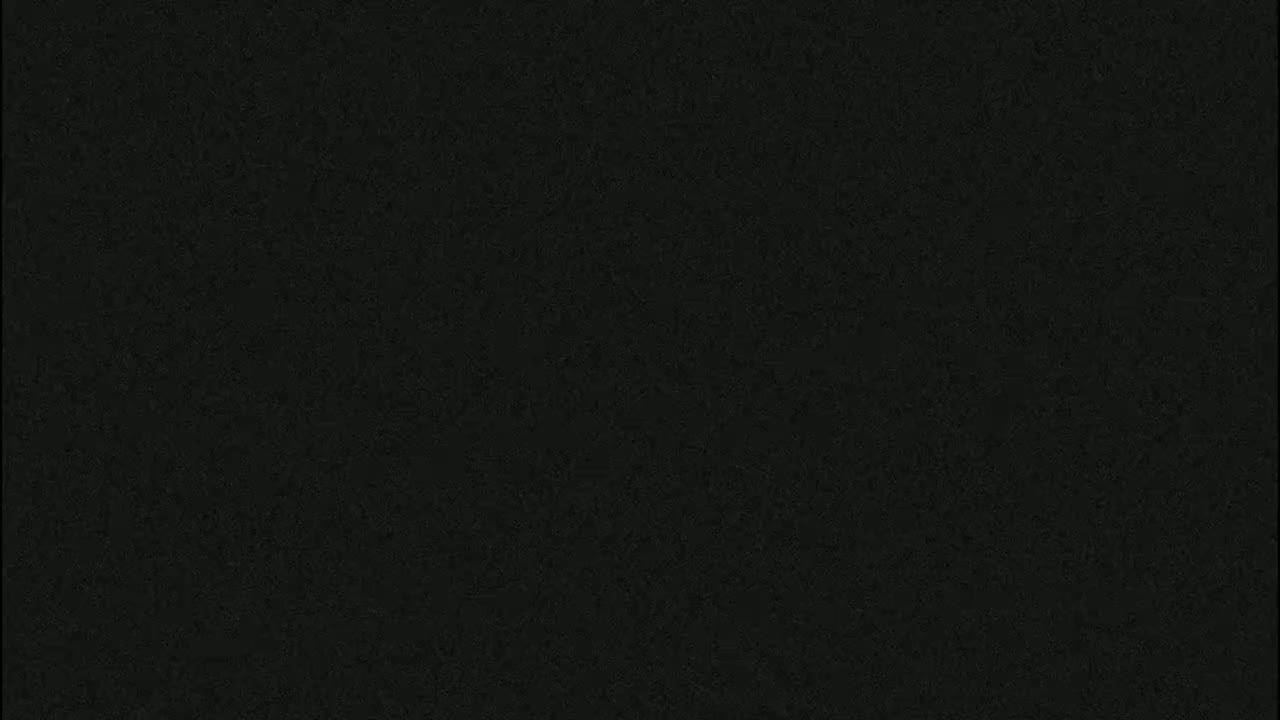 The image shows a solid dark-grey textured background.