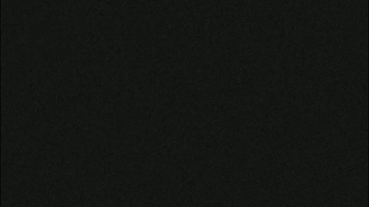 The image shows a dark, textured surface.