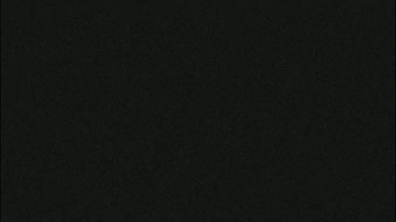 The image shows a uniformly dark gray or black textured surface.