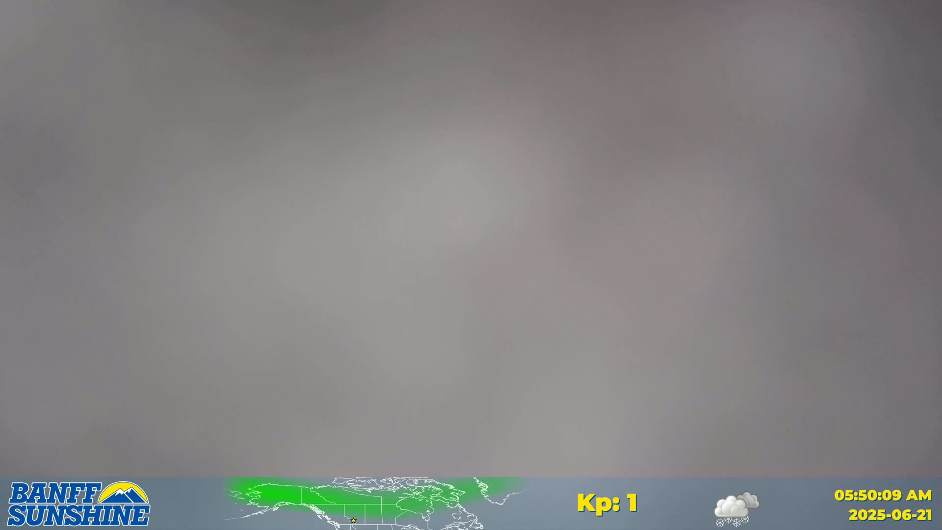 A gray, overcast sky is shown, with a small weather symbol indicating light snow.
