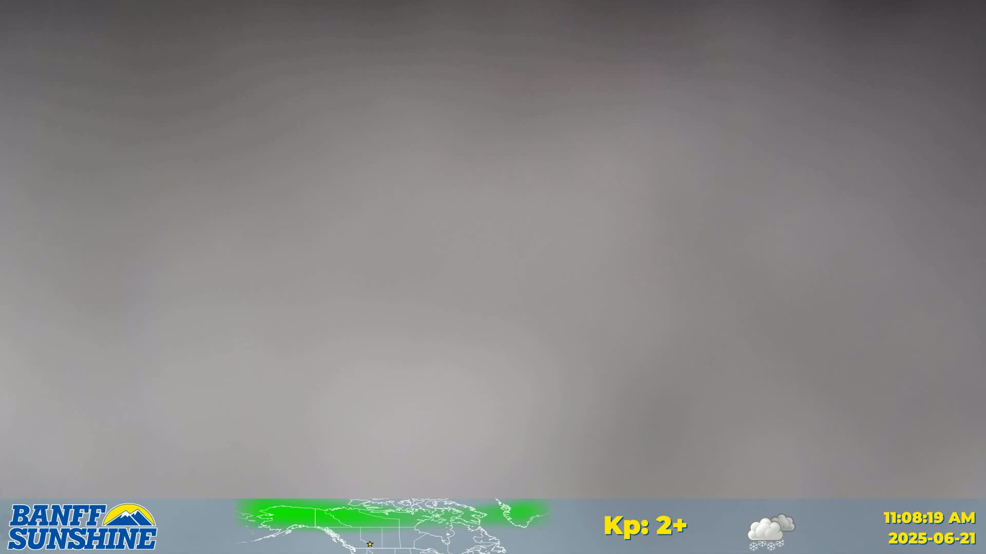 A blurry, overcast sky is shown with a small portion of a world map at the bottom.