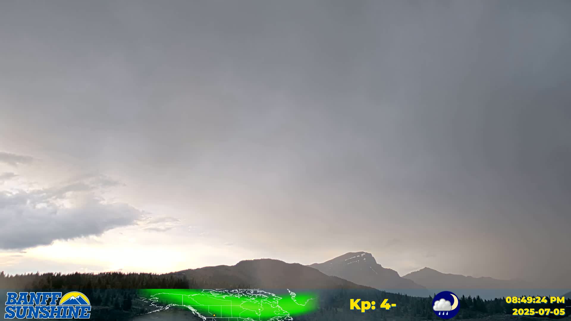 A mostly sunny sky with scattered clouds over a mountainous landscape.
