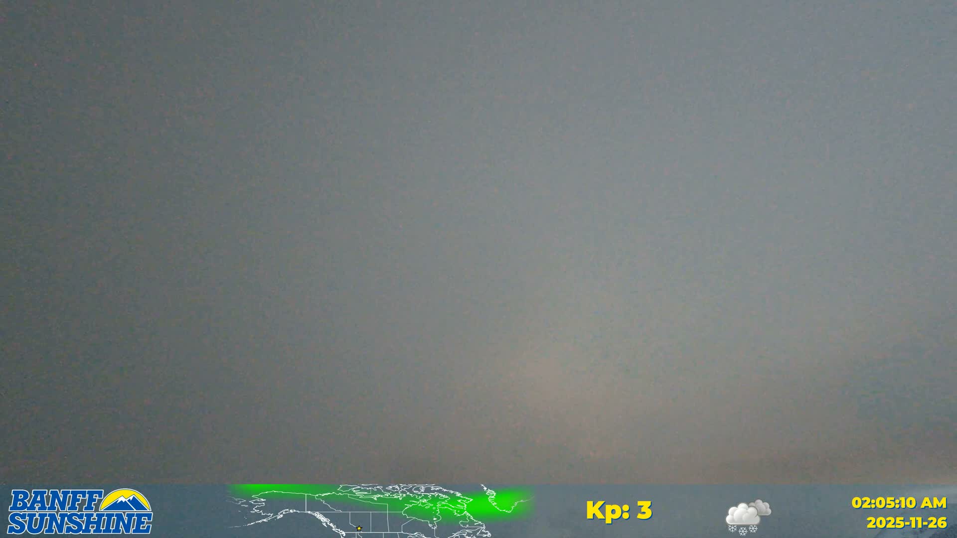 A dark, uniformly gray, and overcast sky is visible, suggesting nighttime conditions.