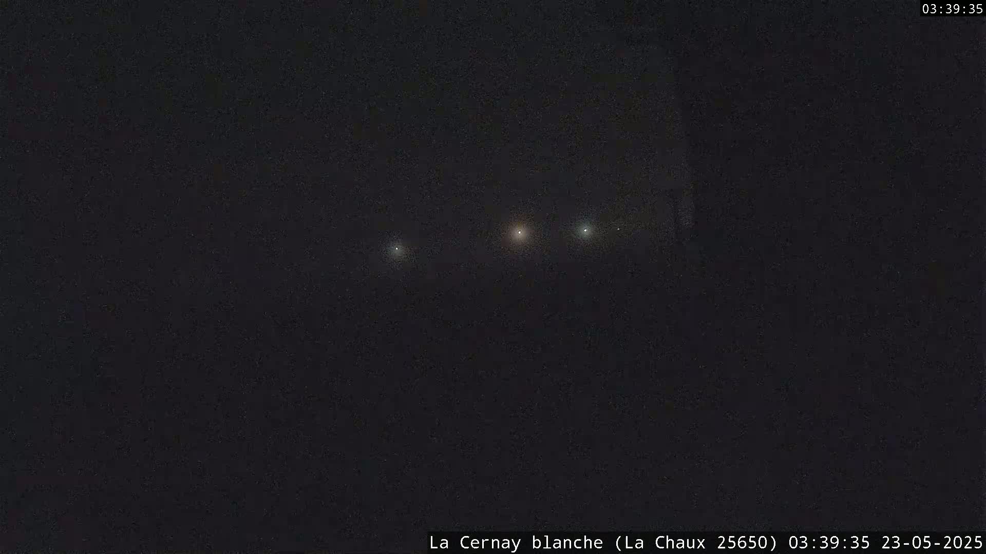 Four lights are visible in the night sky.