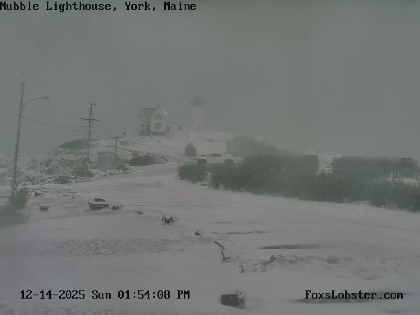 A single, blurry orange light glows against a vast, clear, dark night sky.