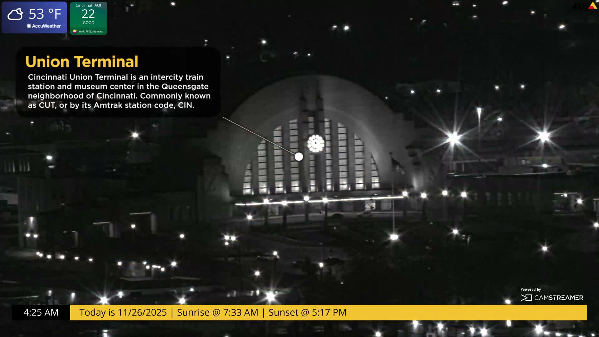 The brightly illuminated Union Terminal stands out against a dark, early morning sky at 53°F and cloudy conditions, surrounded by scattered city lights.