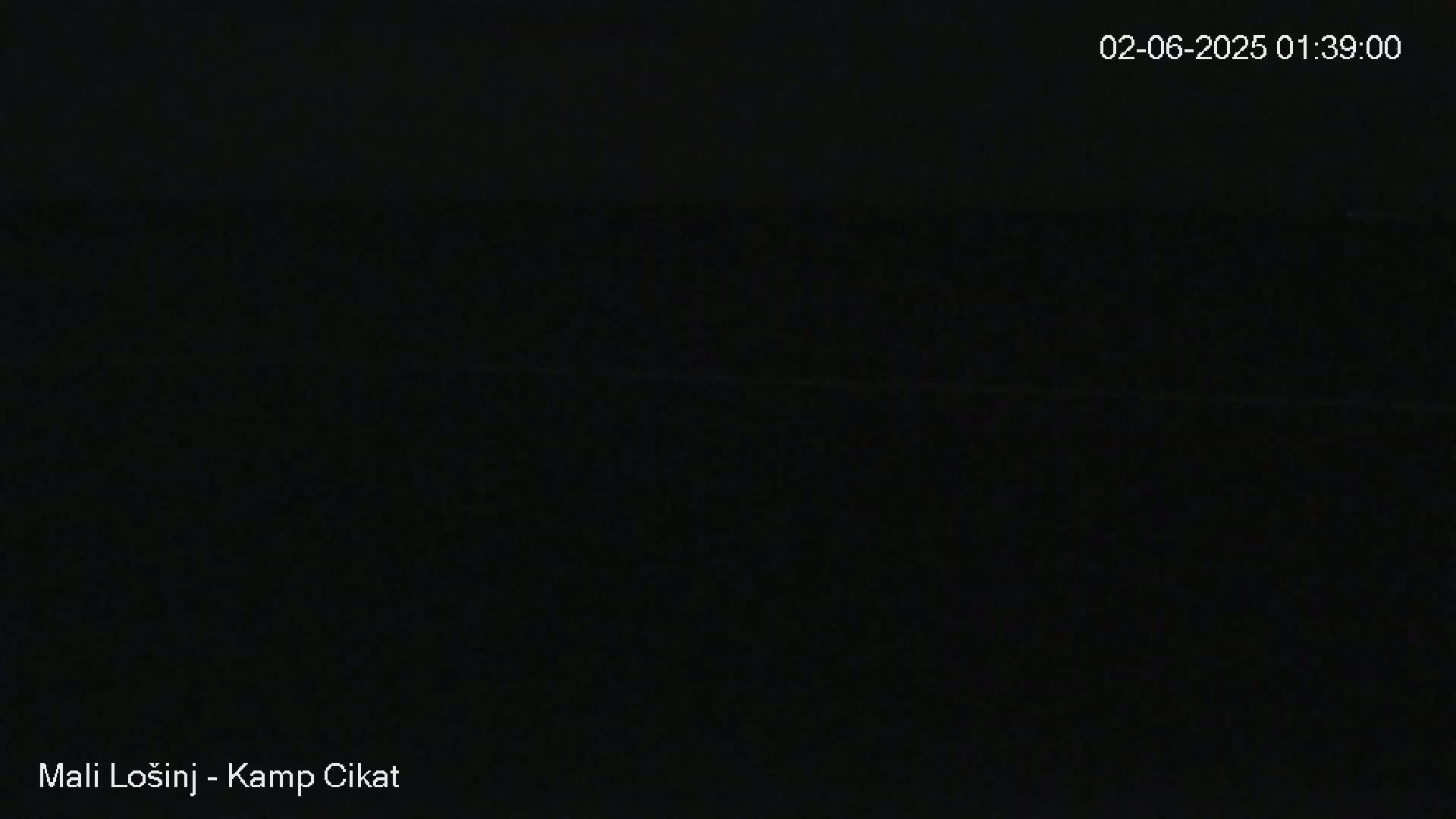The image shows a completely dark scene at night.