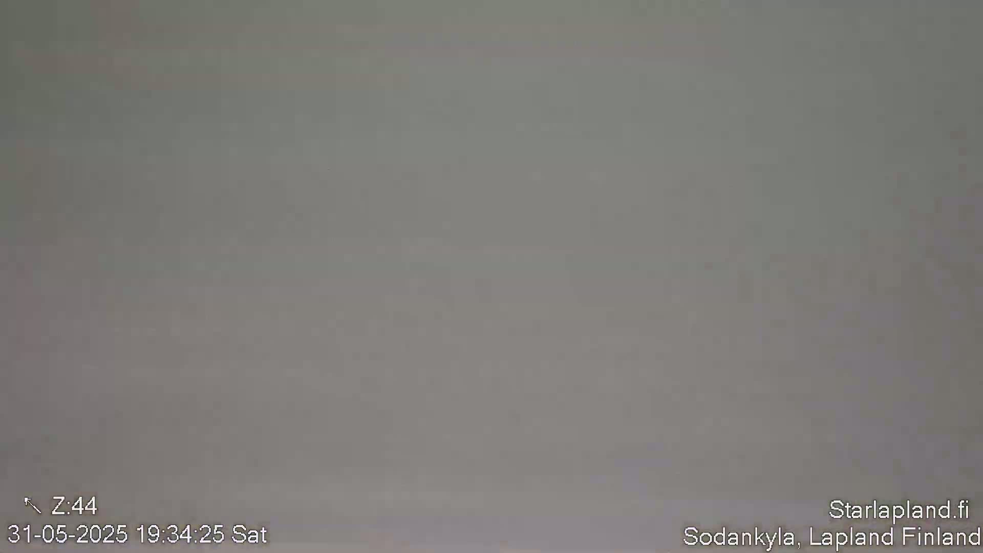 A uniformly gray image shows an overcast sky.