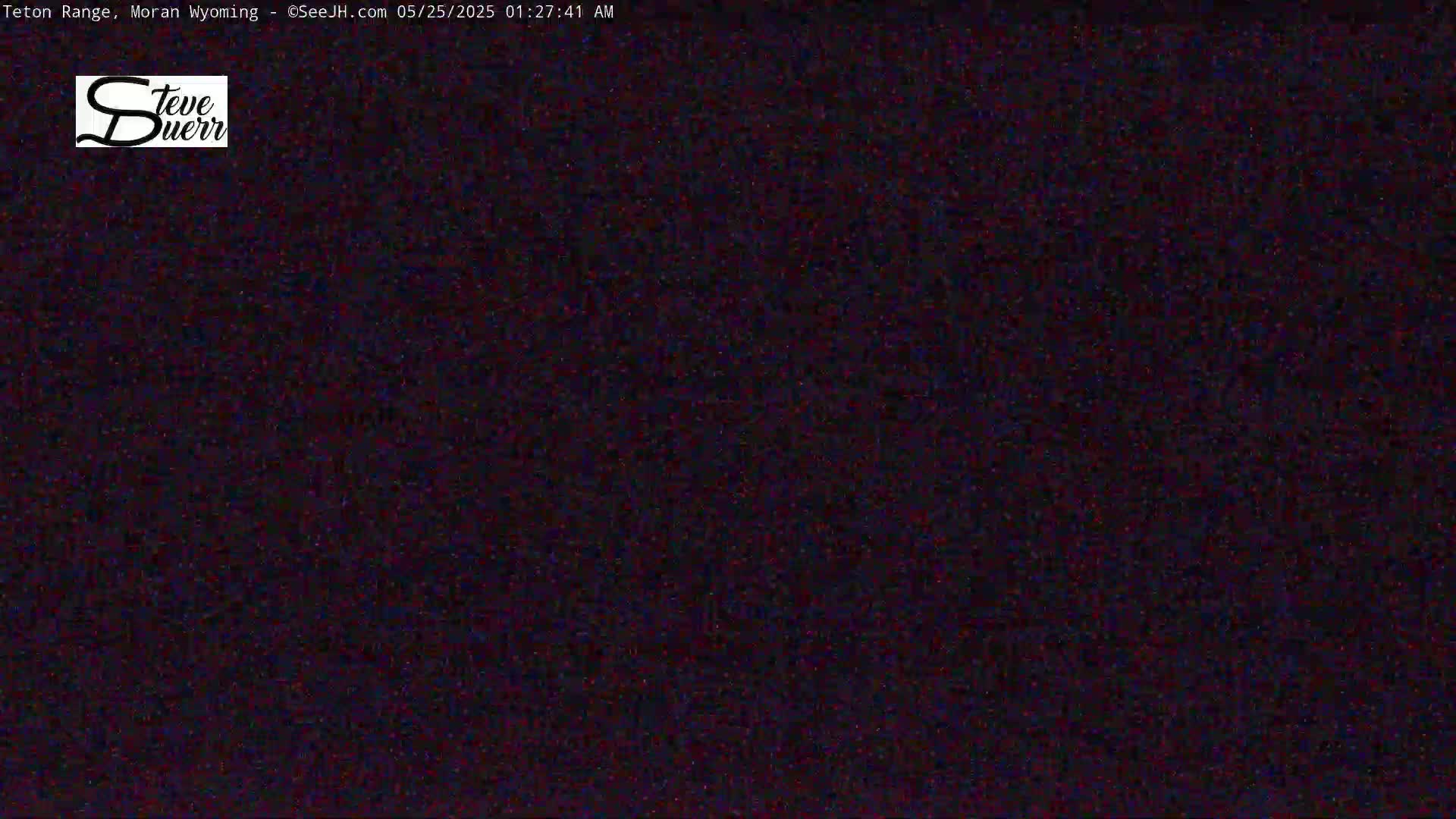 The image shows a completely dark, grainy screen.