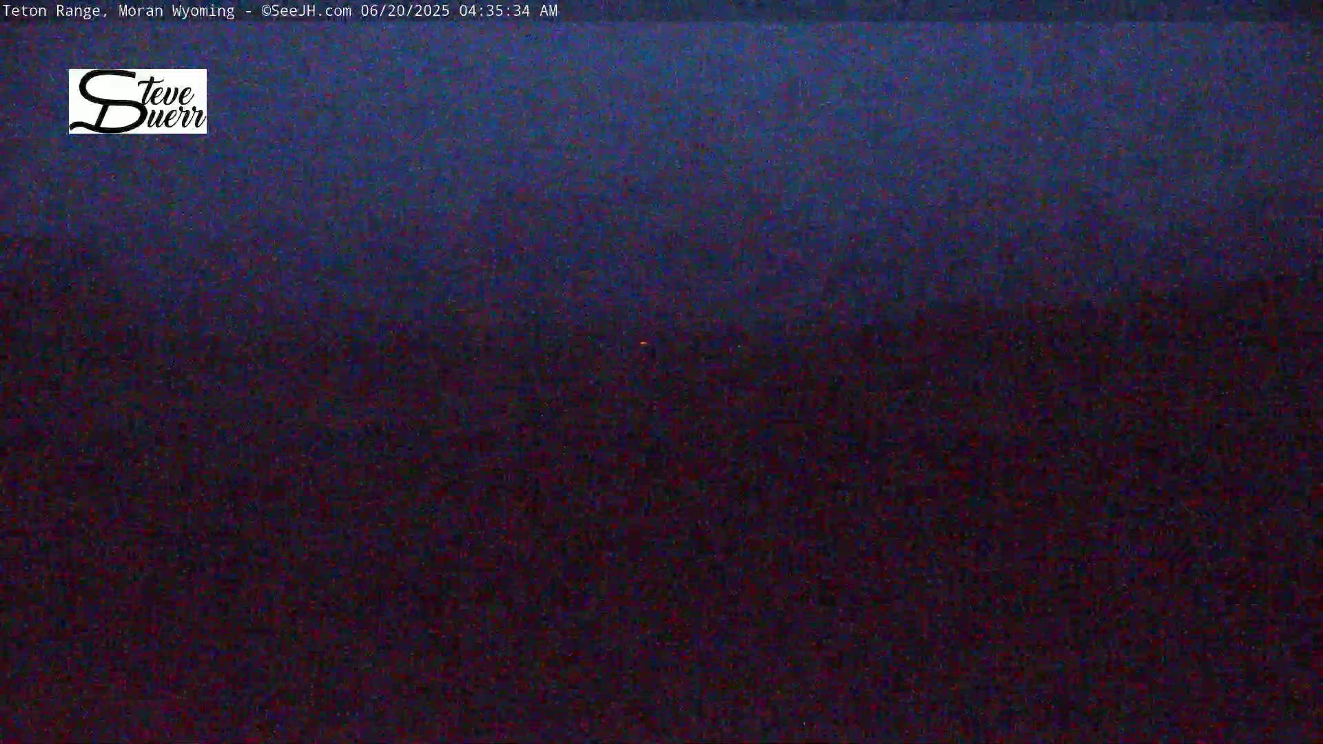 A dark, nighttime landscape is shown, possibly at dawn or dusk.