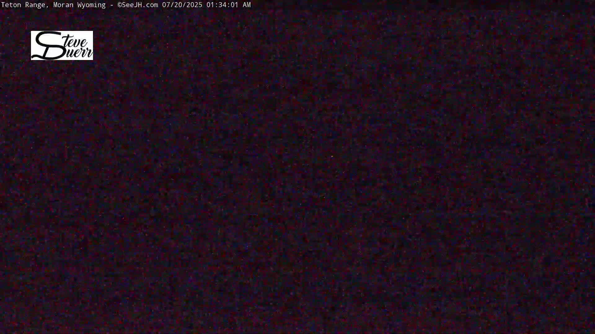 The image shows a completely dark, nighttime scene.