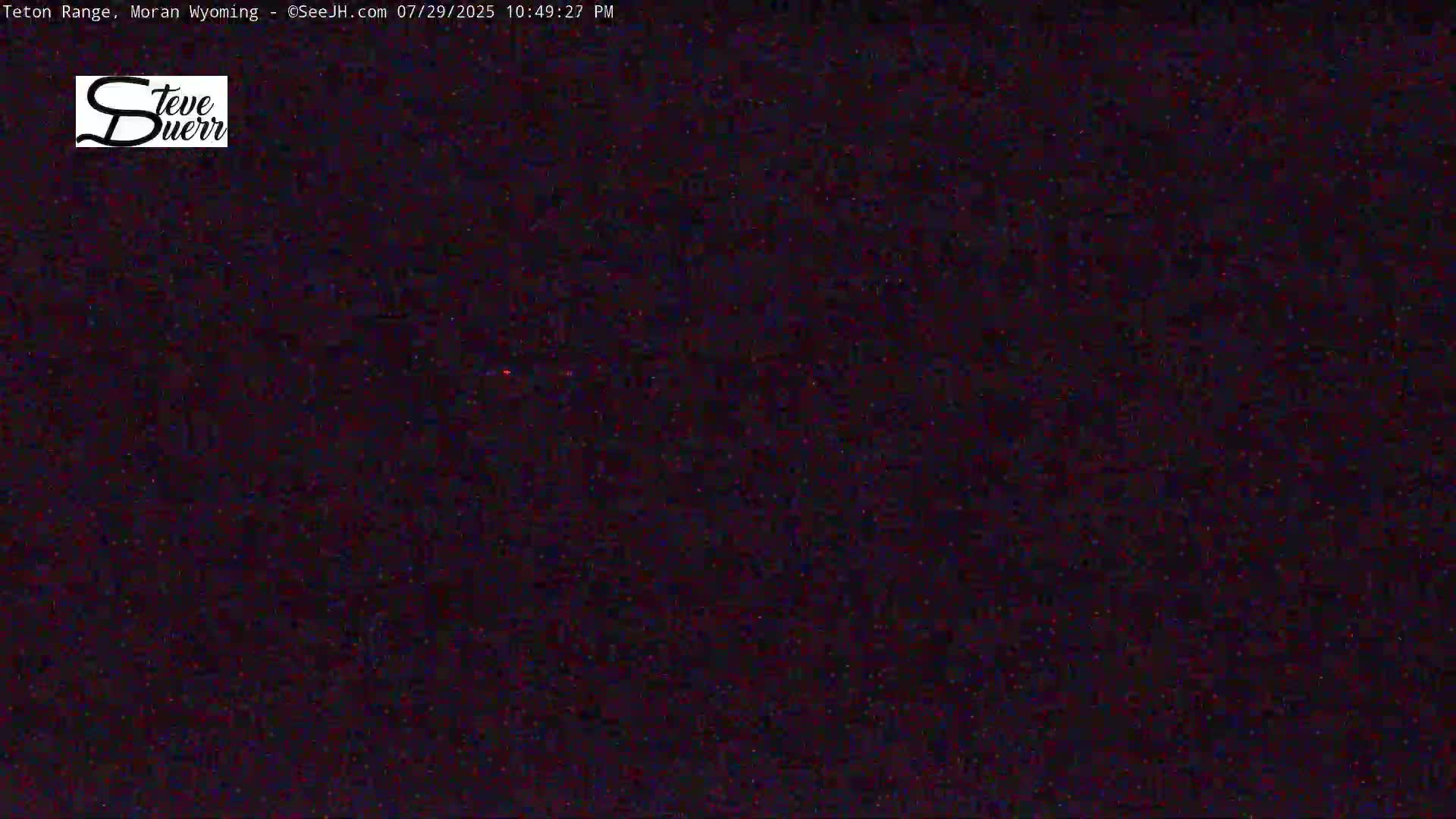 The image shows a completely dark, nighttime scene.