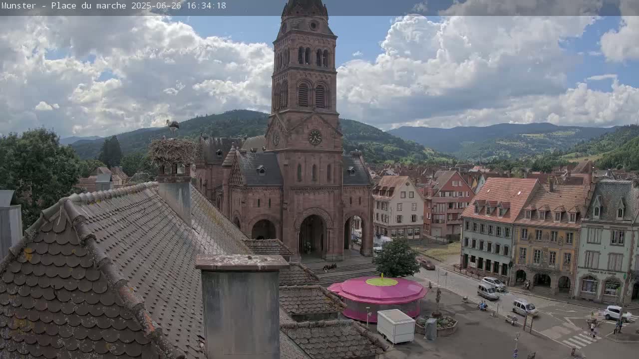 Munster,Place du Marché ( Market Square) & La Fontaine Lion Fountain / Église protestante (Protestant Church) Live Cam -  Colmar-Ribeauvillé, Haut-Rhin, Grand Est, France