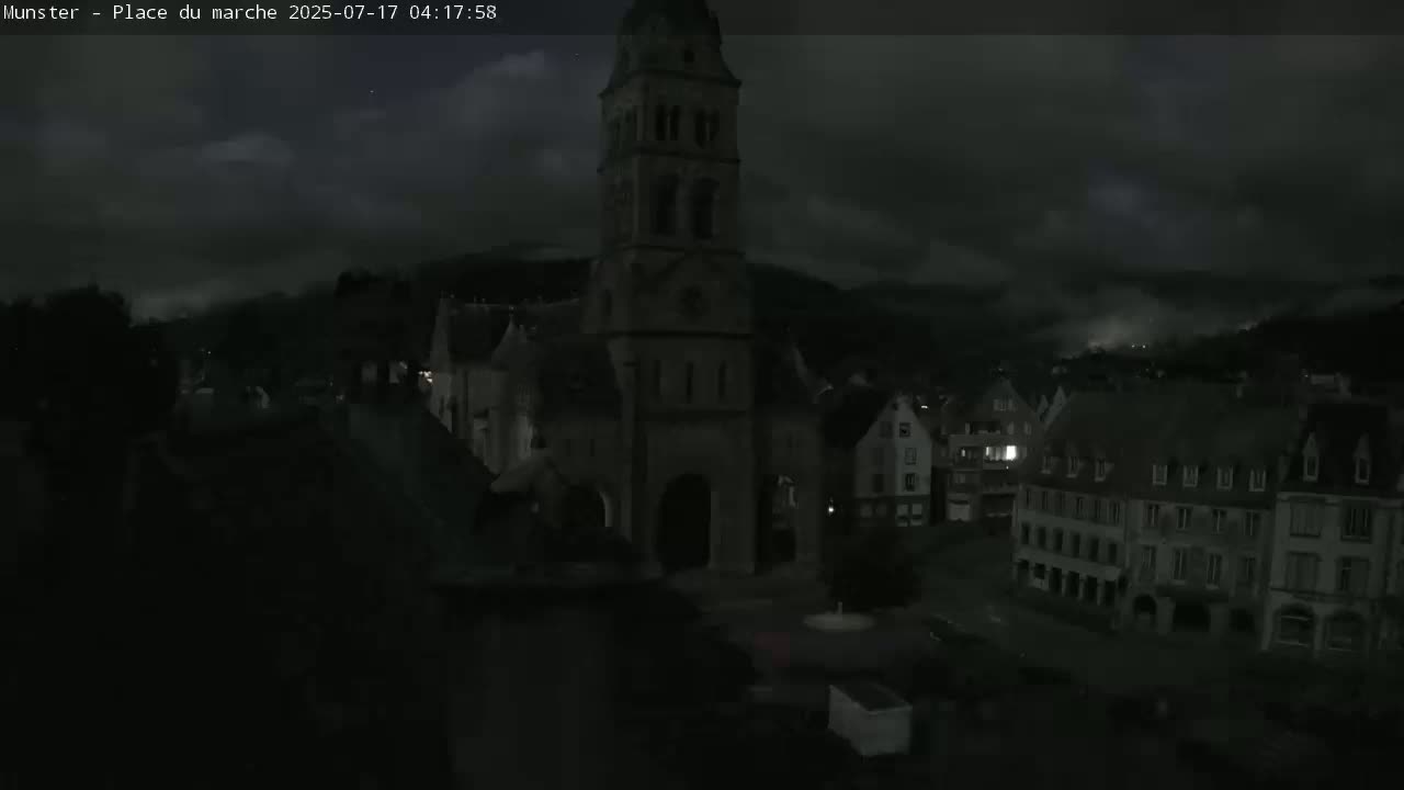 Munster,Place du Marché ( Market Square) & La Fontaine Lion Fountain / Église protestante (Protestant Church) Live Cam -  Colmar-Ribeauvillé, Haut-Rhin, Grand Est, France