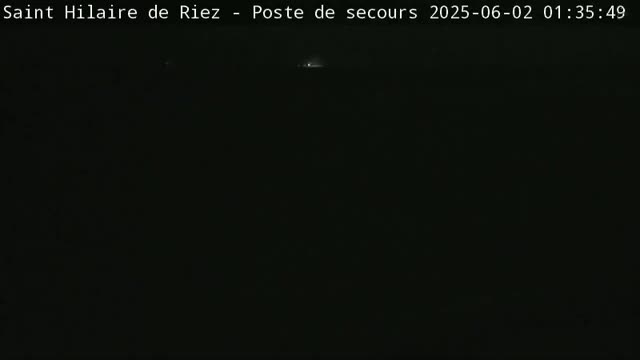 The image shows a completely dark, nighttime scene.