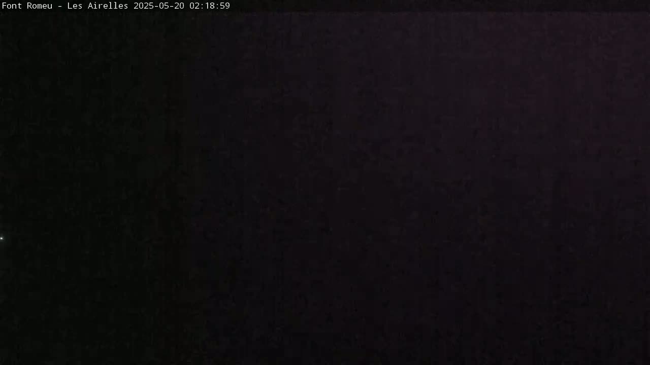 The image shows a dark, nighttime scene with a slightly lighter area in the upper right corner.