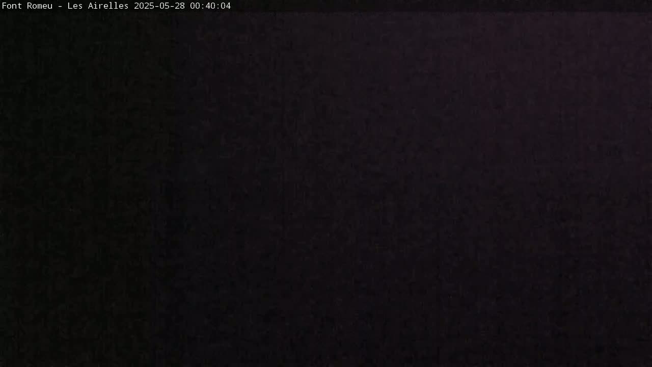The image shows a completely dark, possibly nighttime scene.