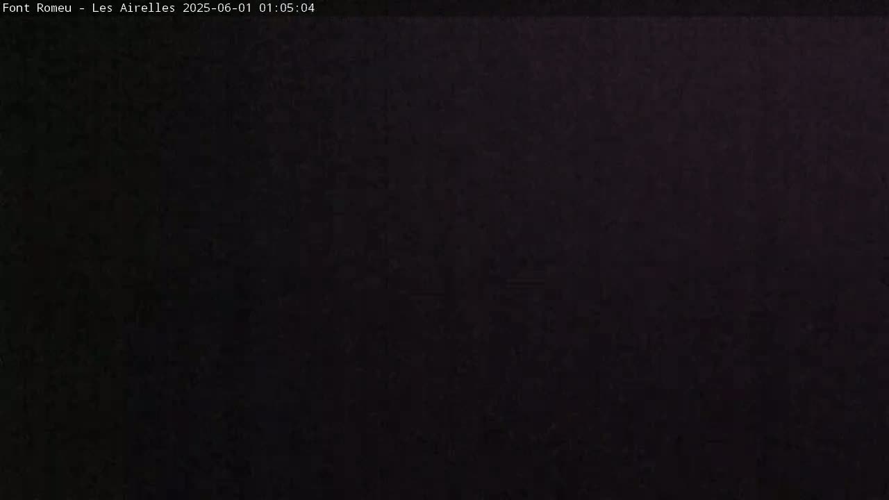 The image is a completely dark, possibly nighttime, outdoor scene.