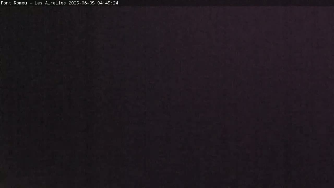 A dark, uniformly colored image shows a solid, nearly black background.