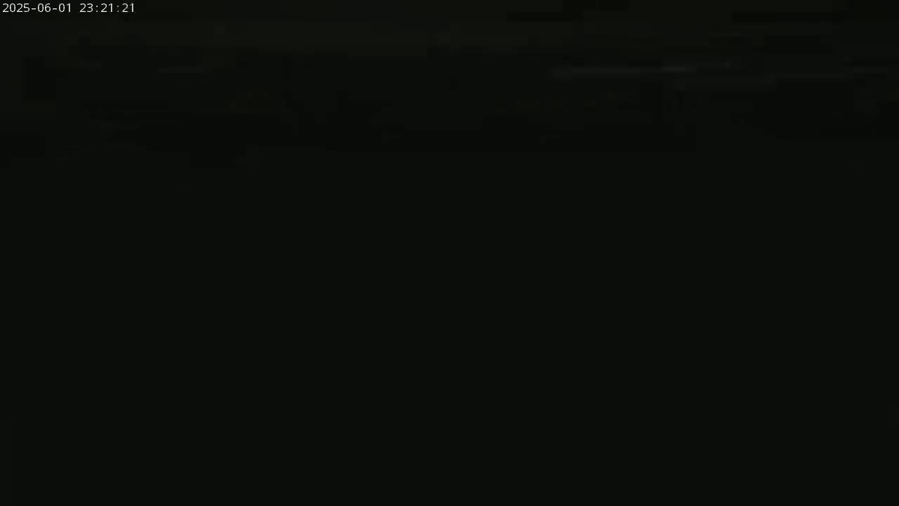 The image is almost entirely black, with a few faint, blurry horizontal lines near the top.