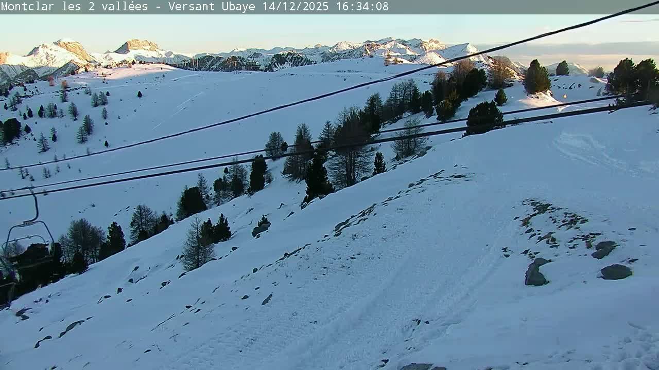 A very blurry, snow-covered outdoor landscape is seen through a precipitation-covered camera lens, indicating heavy snowfall or dense fog with extremely low visibility.
