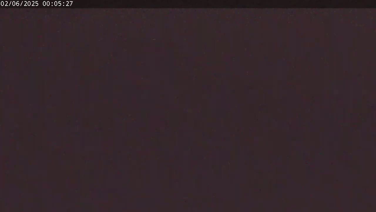 The image is a dark, uniformly colored screen showing mostly black with some subtle variations in tone.