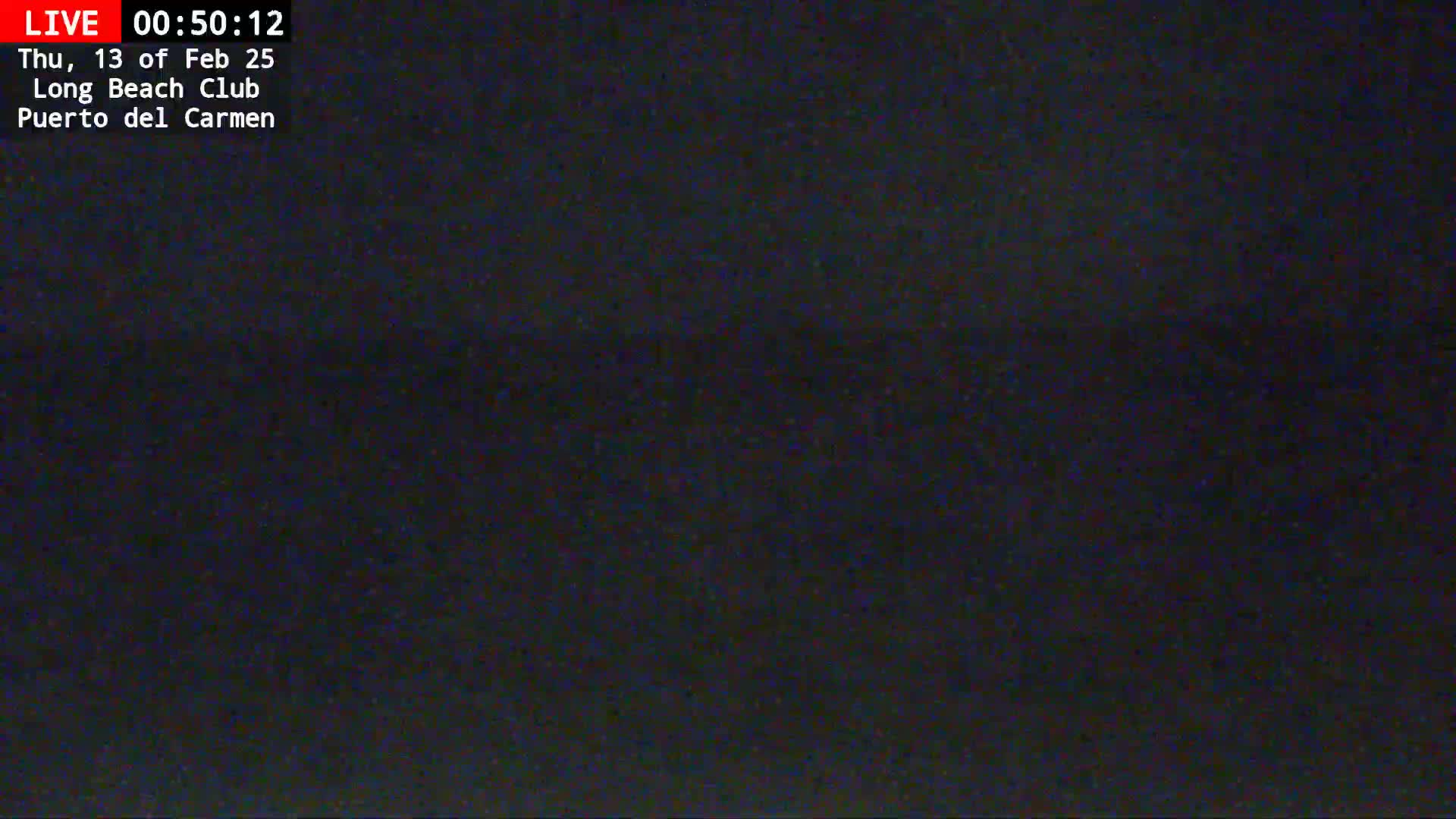 A dark, nighttime image of a mostly black scene, possibly an outdoor view with a dark sky.