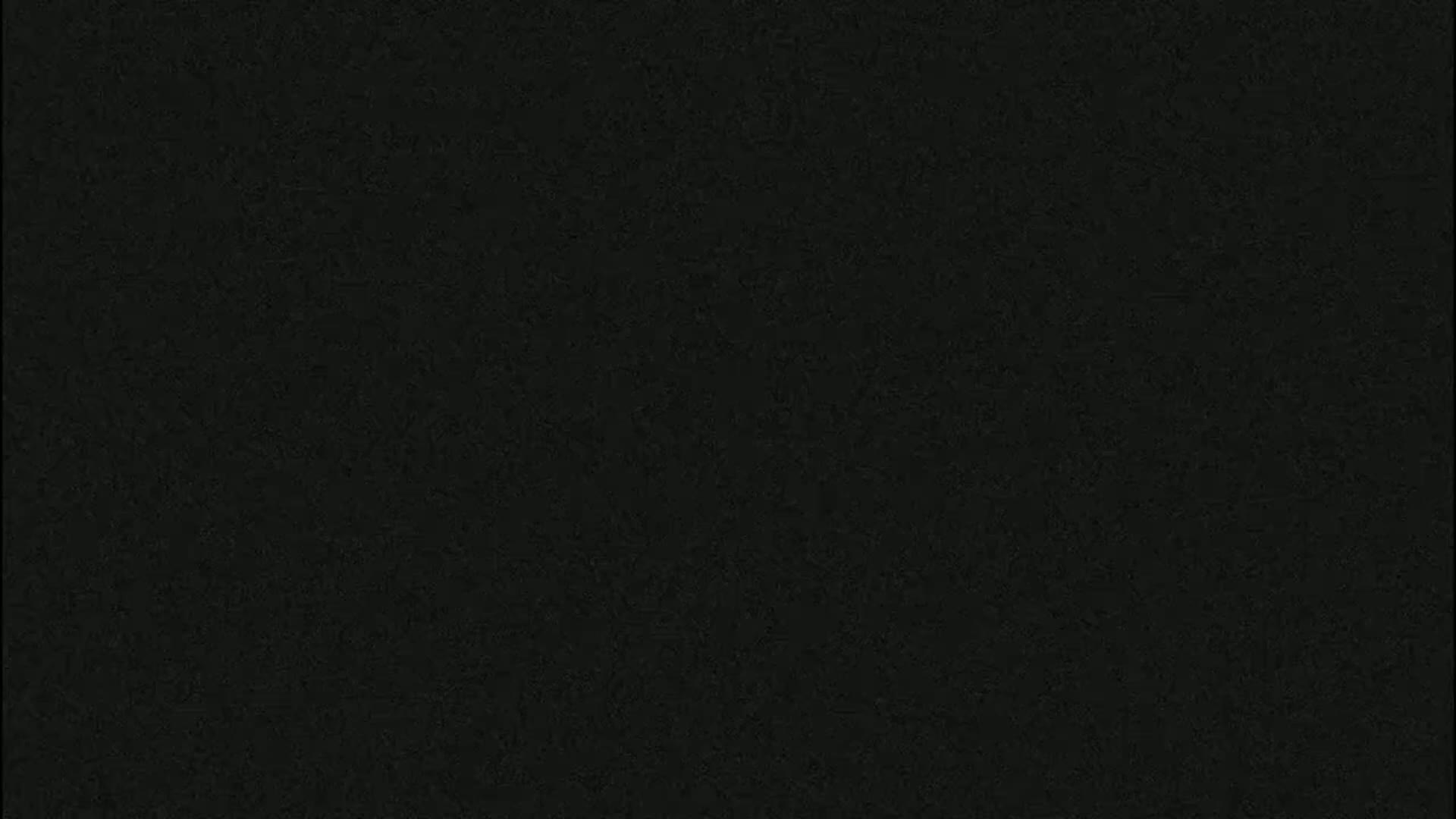 The image shows a uniformly dark gray or black textured surface.