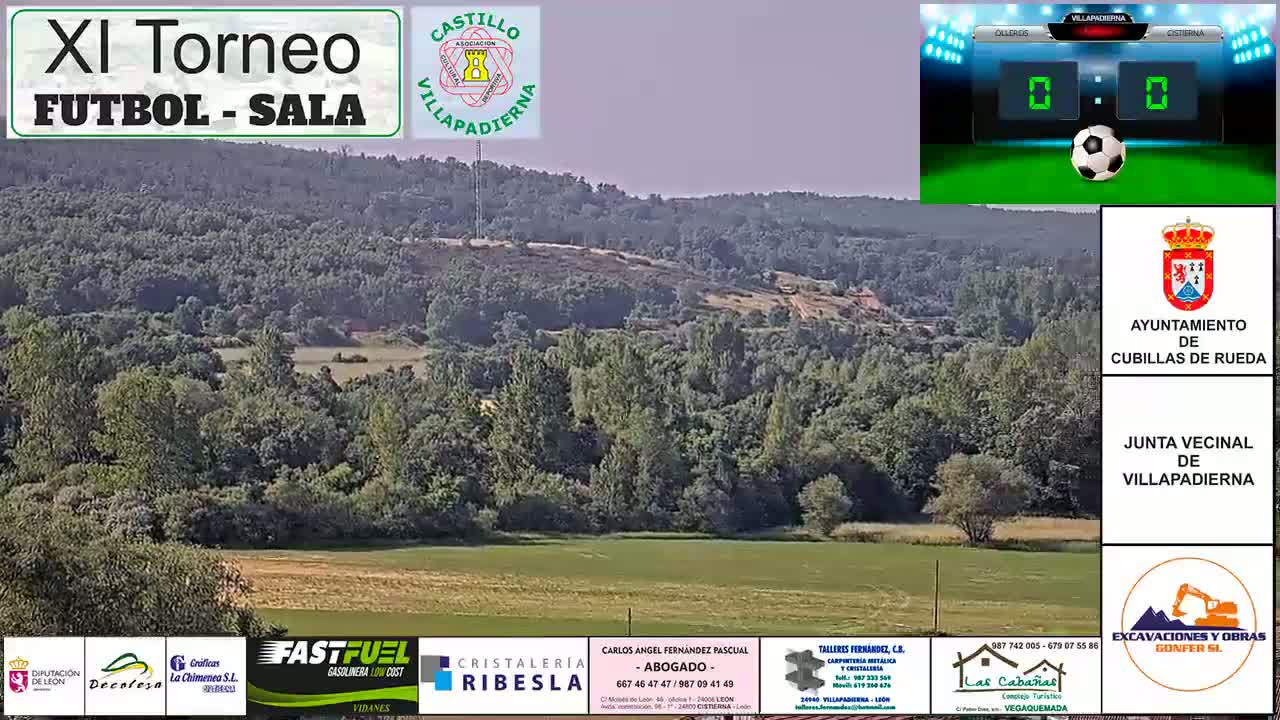 A long shot of a verdant, hilly landscape under a hazy sky shows a field of yellowish-green grass at the bottom of the image, and a forested area stretching beyond.