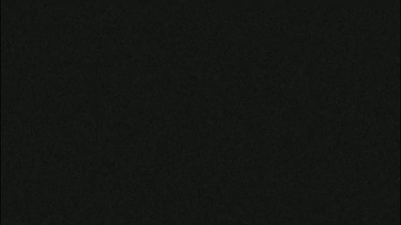 The image is a dark, uniformly textured surface.