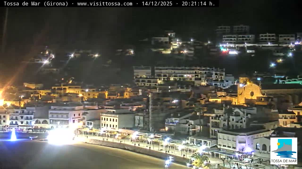 A small boat floats on calm ocean waters under a clear and bright sky, with intense morning sunlight shimmering across the surface.