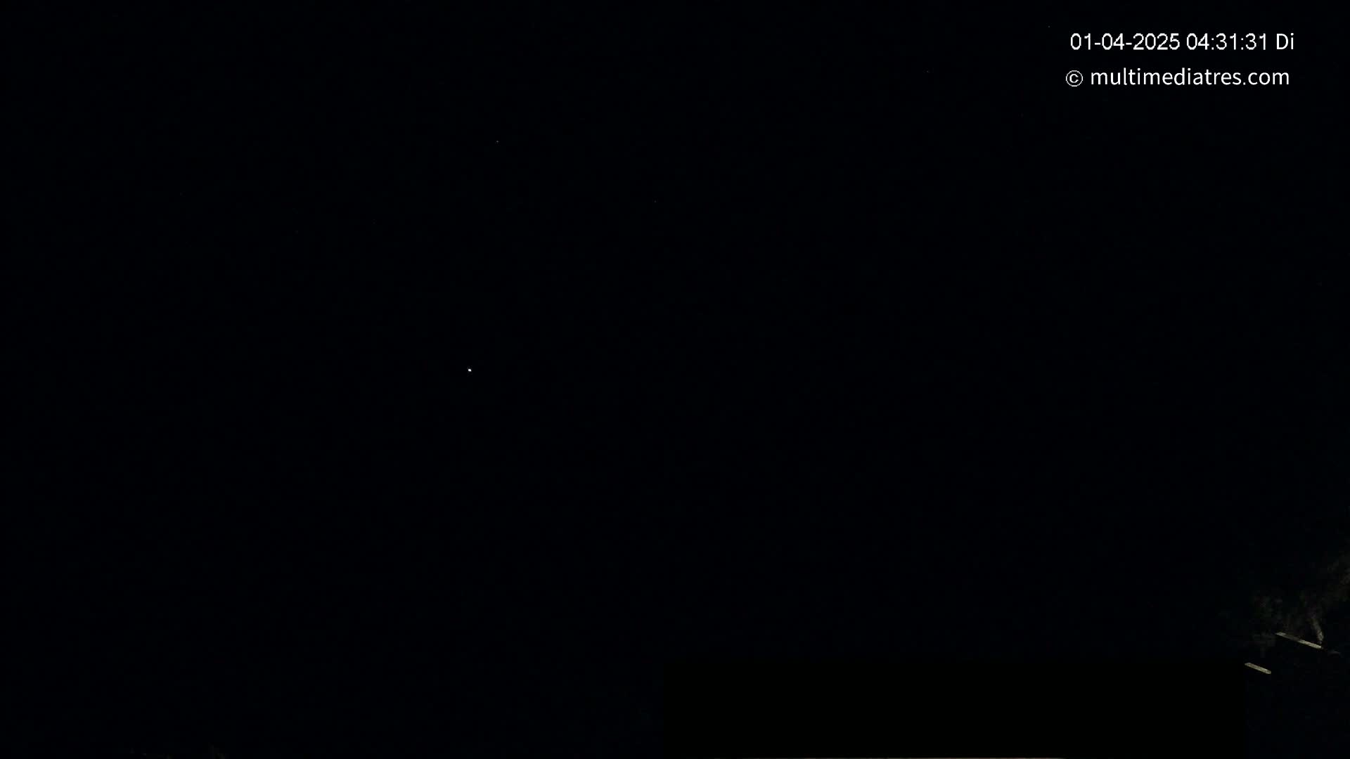 A dark night sky shows a few faint stars.