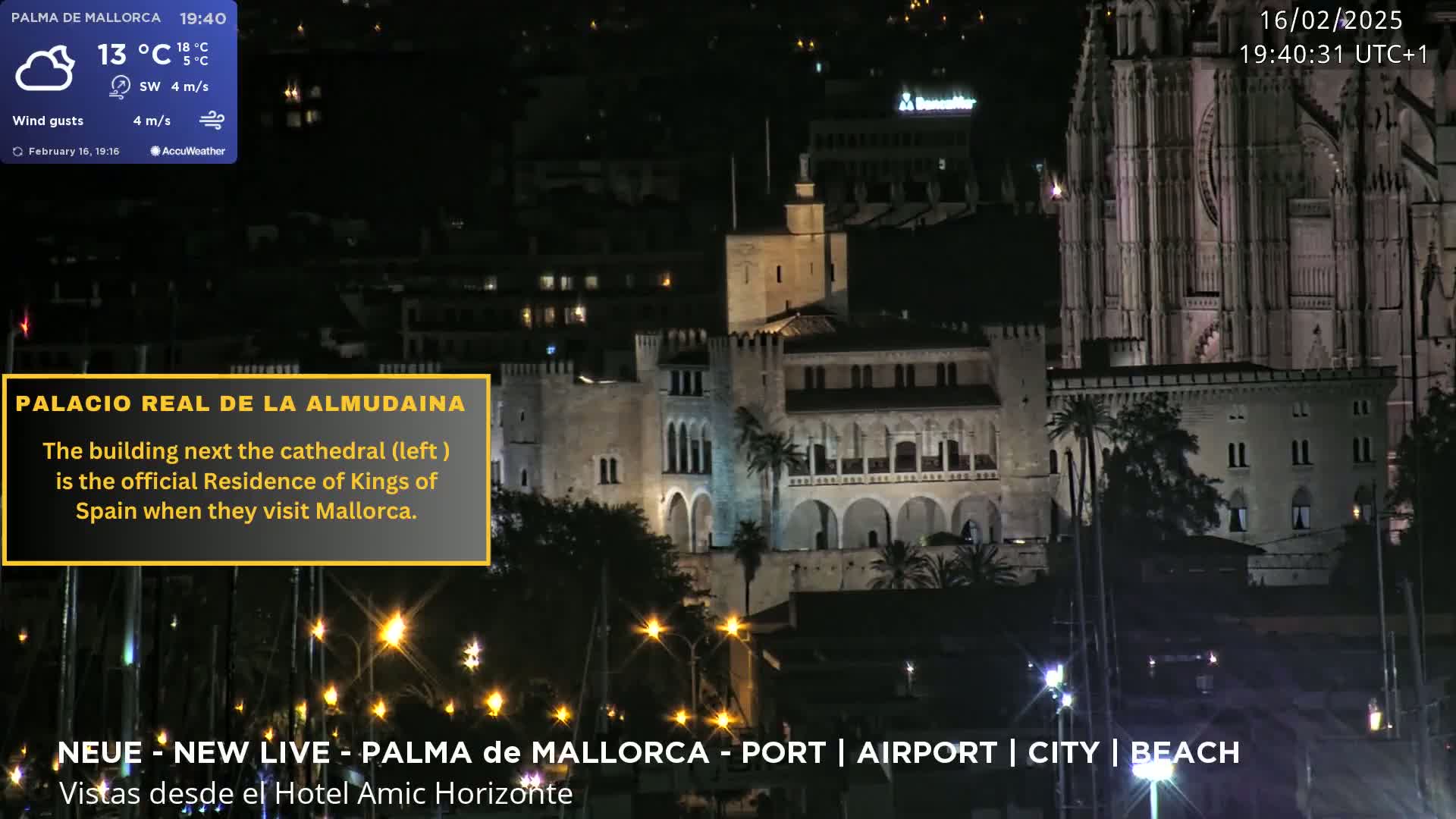 A nighttime view of a castle-like building next to a large cathedral, illuminated against a dark, cloudy sky.