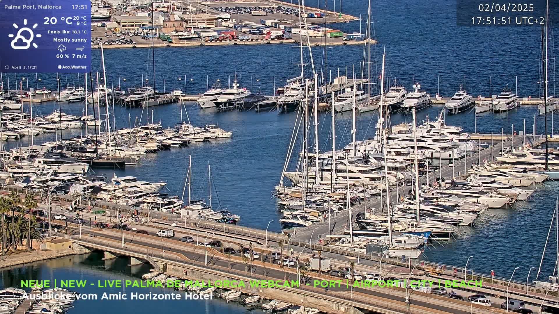A mostly sunny harbor filled with numerous yachts and sailboats on a mostly sunny day.