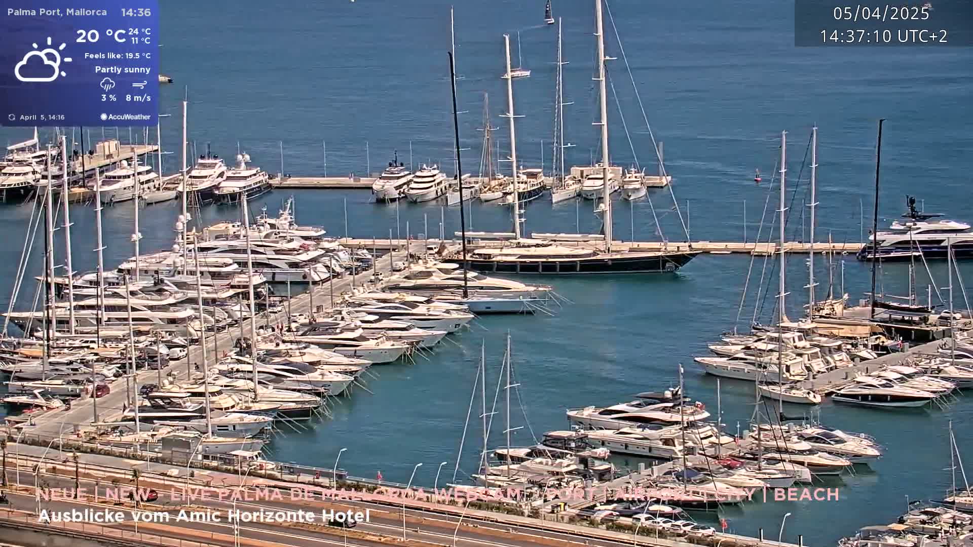A marina filled with numerous yachts and sailboats on a partly sunny day.