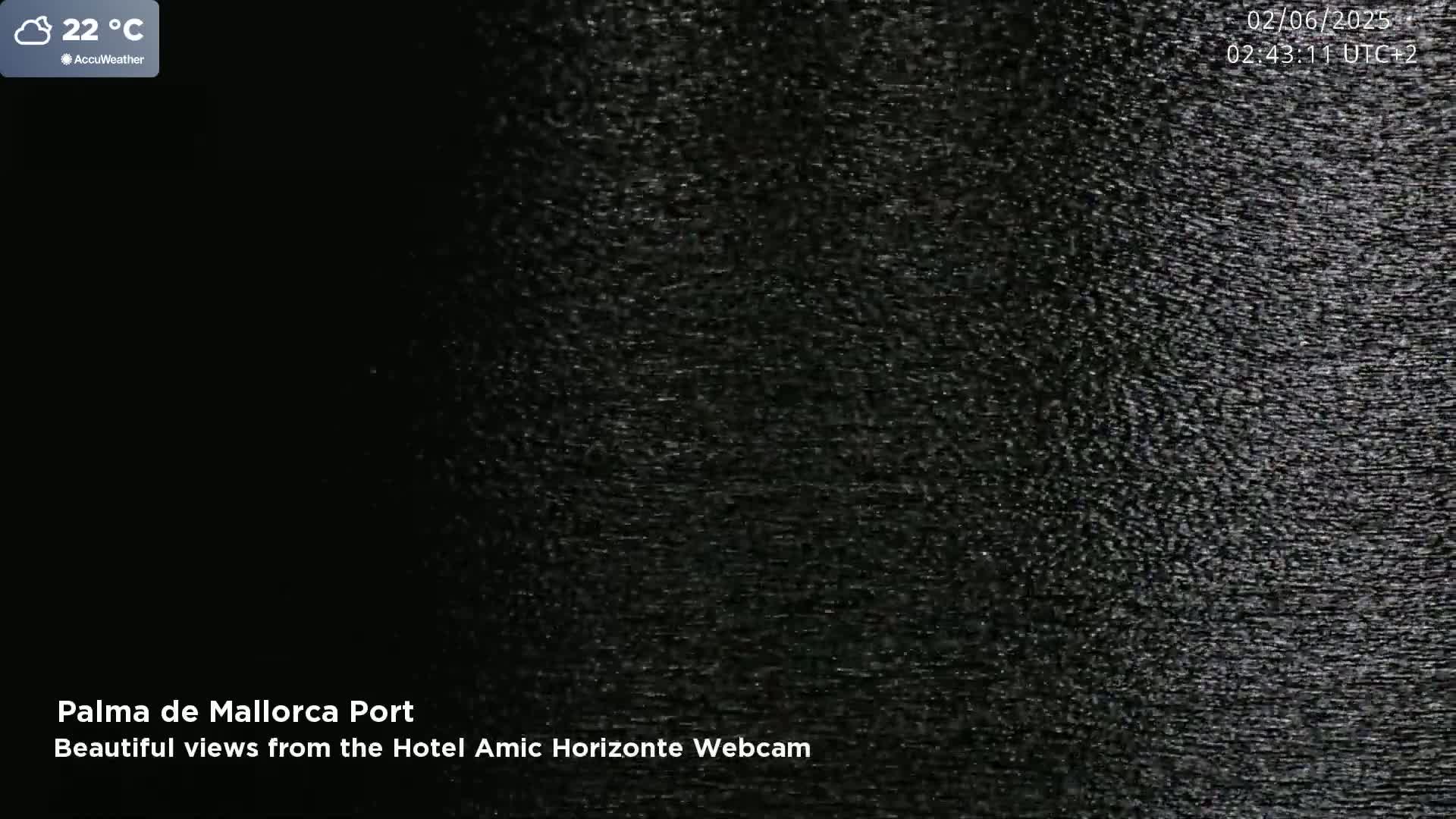 A mostly dark image shows a grainy, textured surface at 22°C.
