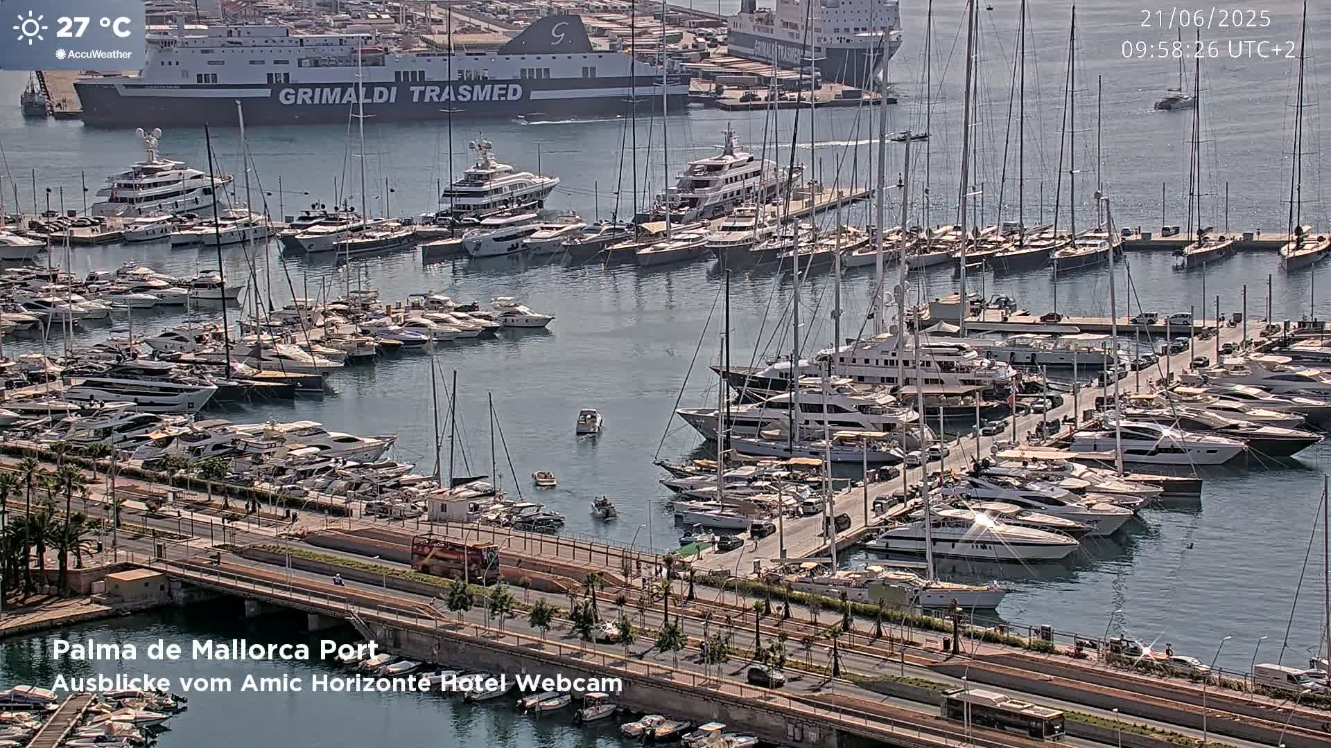 A harbor filled with numerous yachts and sailboats on a sunny day.