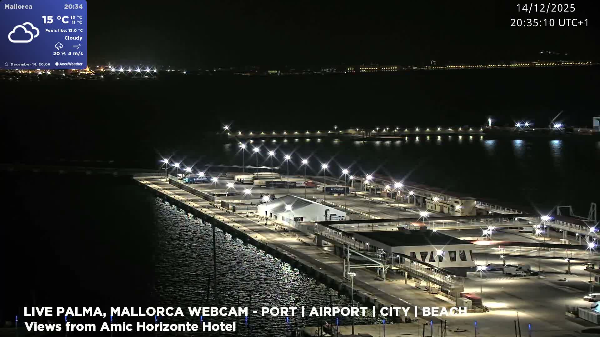 A large cruise ship and a ferry are docked in a bright harbor, with intense sunlight glinting off the water under a hazy, muted sky.